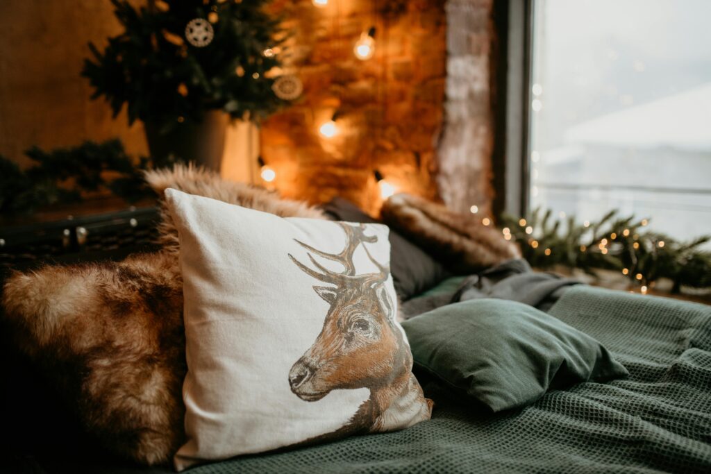 White and Brown Throw Pillow on Gray Textile